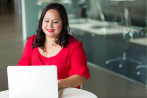 Hispanic Female Professional Working on Laptop